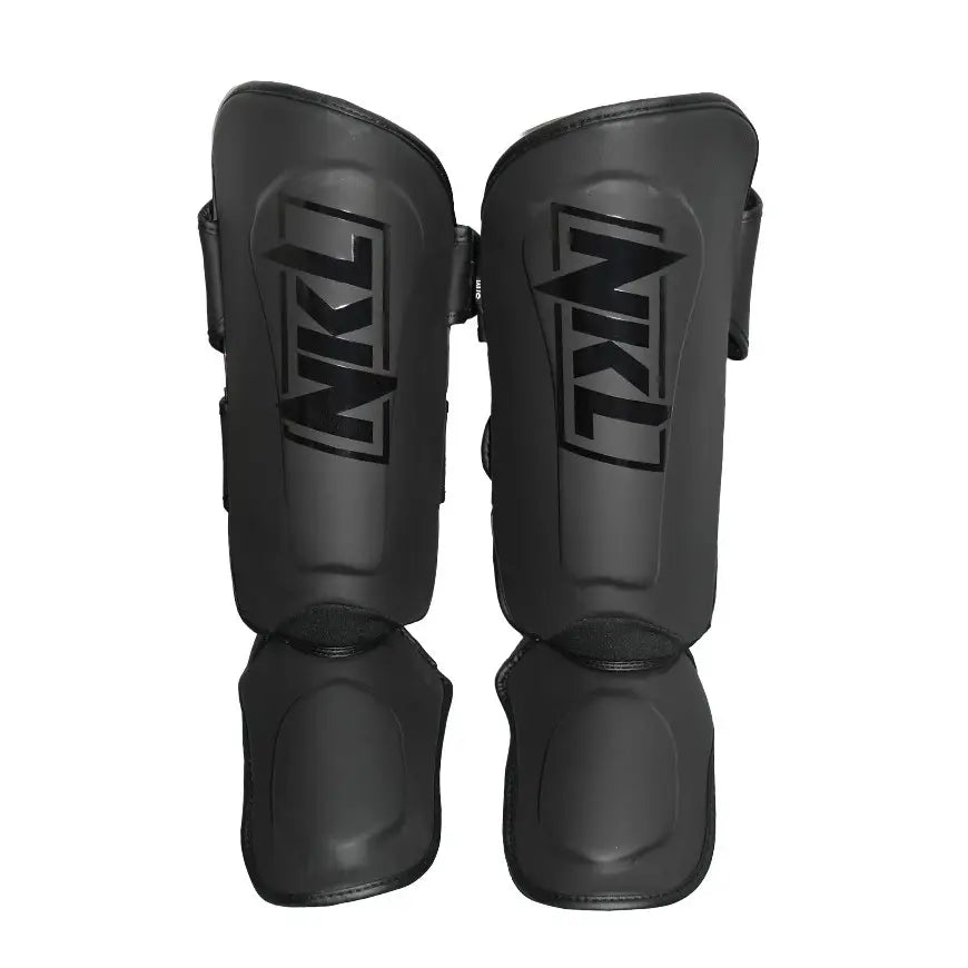 Espinilleras NKL Pro Series Negro Mate para Muay Thai y MMA