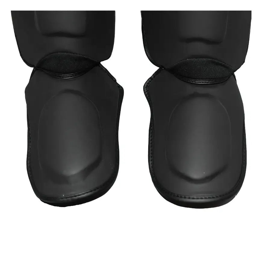 Espinilleras NKL Pro Series Negro Mate para Muay Thai y MMA